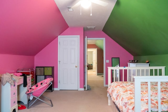 carpeted bedroom featuring visible vents, a ceiling fan, and vaulted ceiling