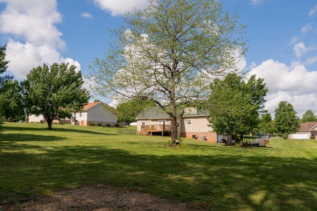 view of yard featuring a wooden deck