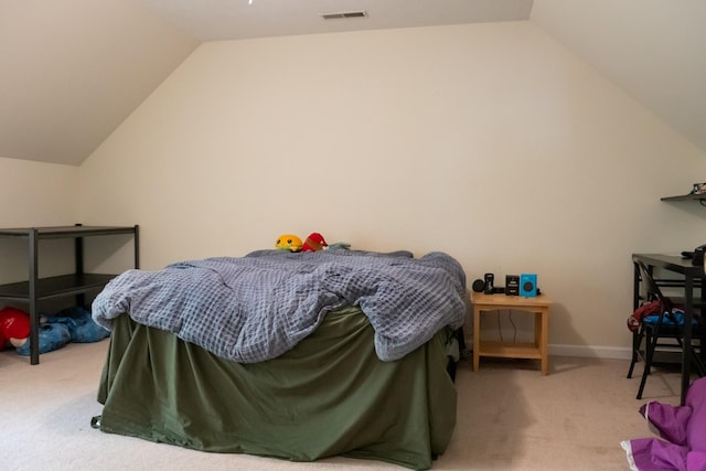 bedroom featuring visible vents, carpet flooring, baseboards, and lofted ceiling