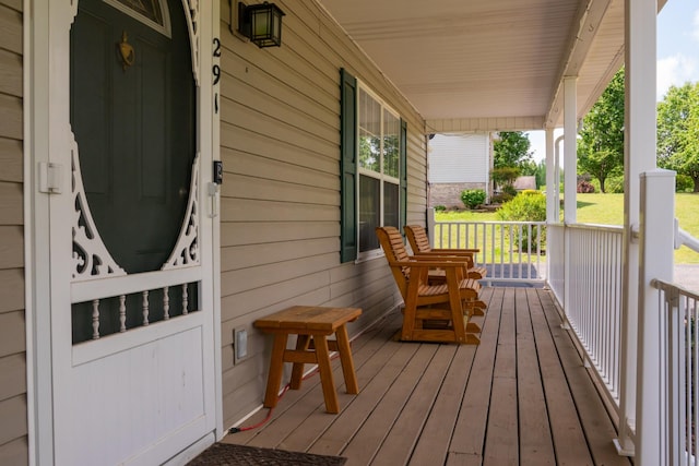 wooden deck featuring covered porch