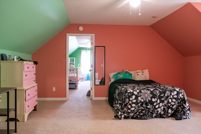 carpeted bedroom featuring a ceiling fan, baseboards, and lofted ceiling