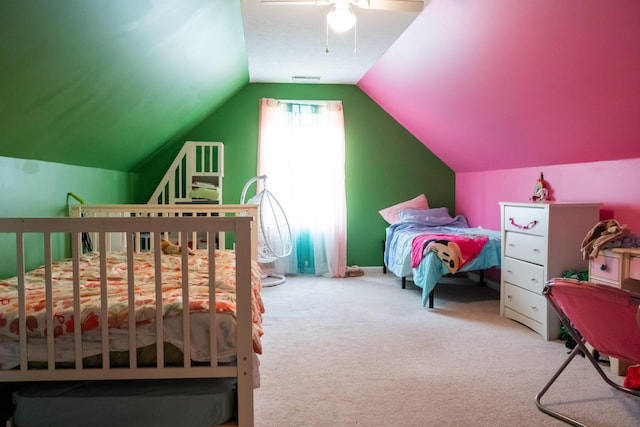 bedroom featuring a ceiling fan, lofted ceiling, and carpet