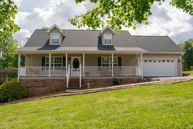 view of front facade with a garage, a front lawn, roof with shingles, and covered porch