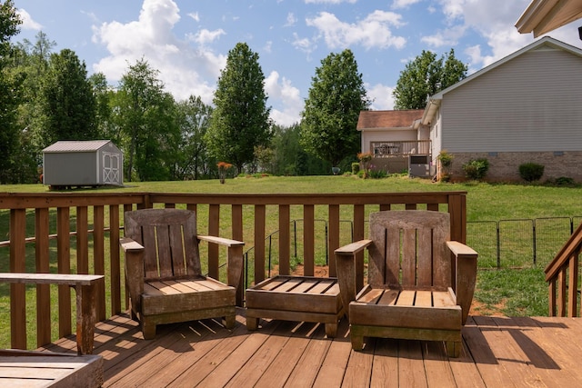 wooden terrace with a yard, an outbuilding, and a storage unit