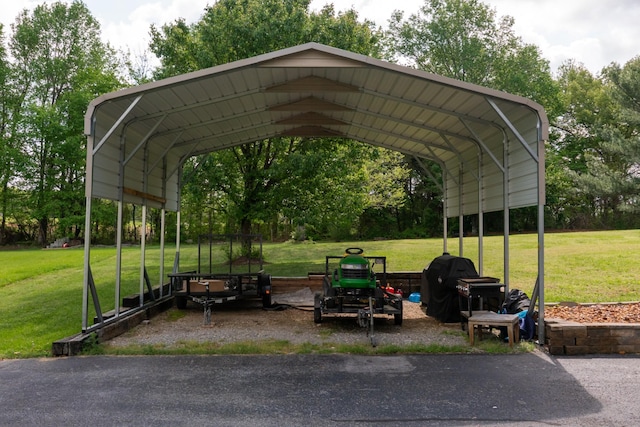 view of vehicle parking with a detached carport and driveway