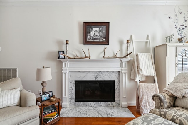 1408 Ridley Dr, Franklin, TN 37064 - living room featuring a premium fireplace, wood finished floors, and ornamental molding