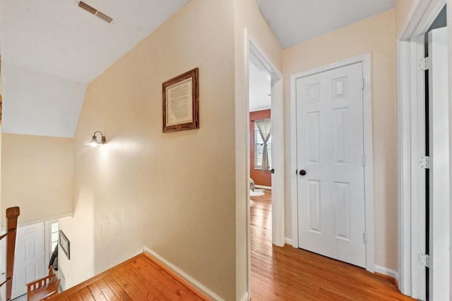 1408 Ridley Dr, Franklin, TN 37064 - hall with an upstairs landing, light wood finished floors, and baseboards