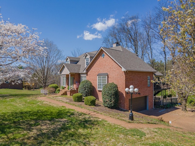 1408 Ridley Dr, Franklin, TN 37064 - view of side of home with brick siding, an attached garage, a lawn, a chimney, and a shingled roof