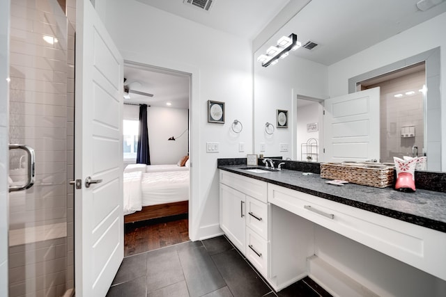 ensuite bathroom featuring tile patterned flooring, vanity, ensuite bath, visible vents, and tiled shower