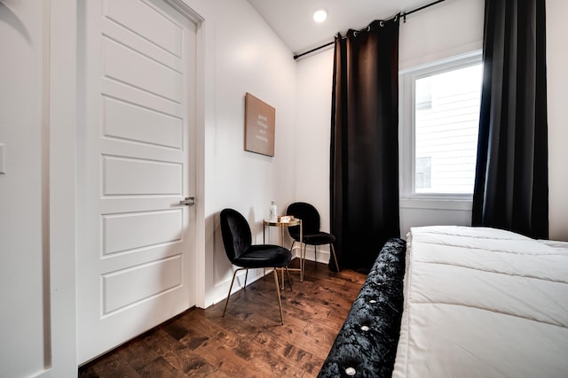 bedroom with recessed lighting and dark wood-style floors