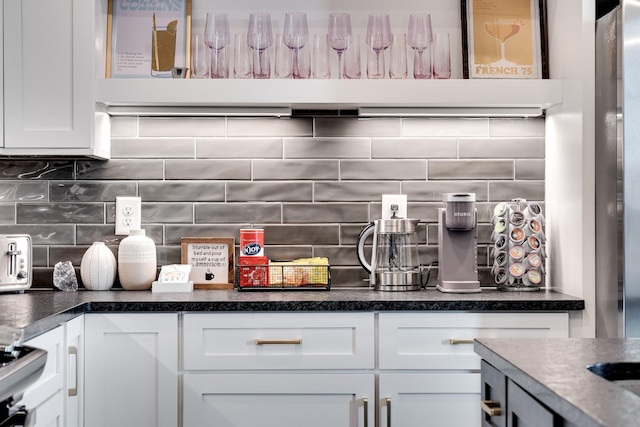 interior space featuring range and tasteful backsplash