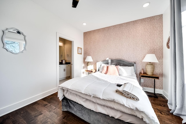 bedroom featuring baseboards, recessed lighting, wood finished floors, and connected bathroom