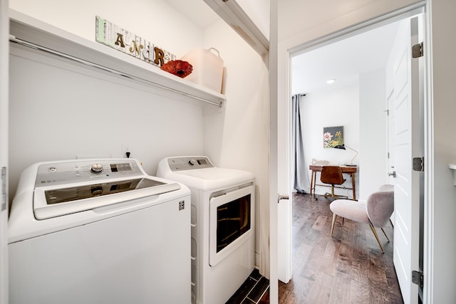 laundry room with separate washer and dryer, laundry area, and dark wood-style floors
