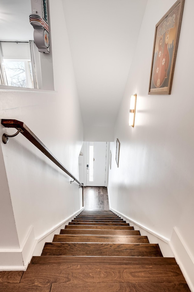 stairs with hardwood / wood-style floors