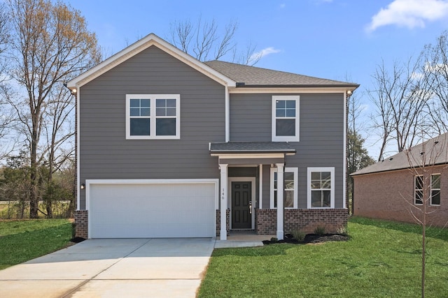 traditional home featuring brick siding, a front lawn, an attached garage, and driveway