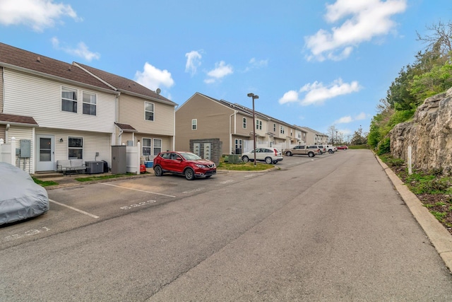 view of street with curbs and a residential view