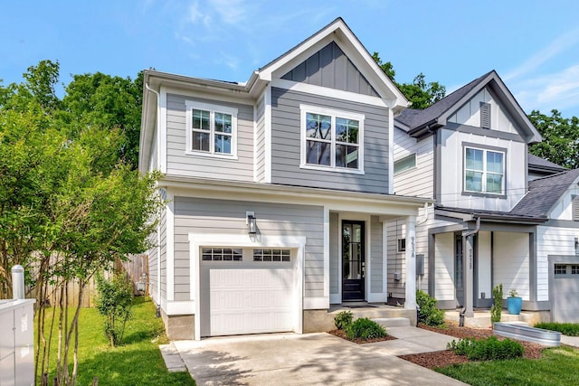 craftsman inspired home with a garage, fence, board and batten siding, and driveway