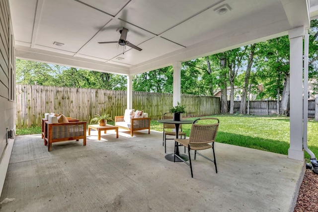 view of patio / terrace featuring outdoor lounge area, a ceiling fan, and a fenced backyard