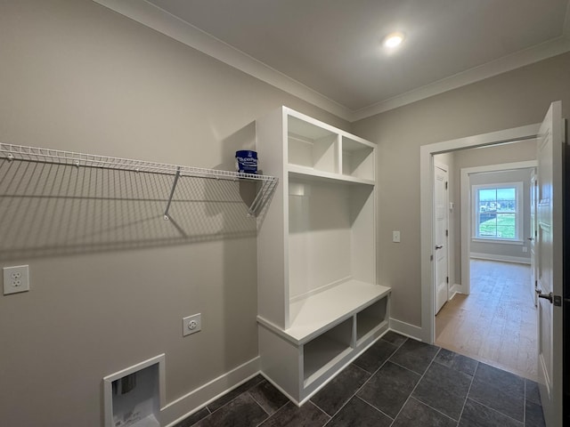 mudroom featuring crown molding and baseboards