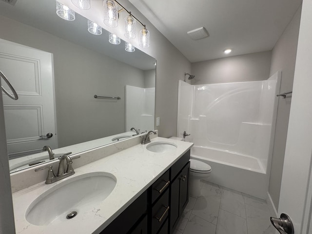 bathroom featuring shower / washtub combination, a sink, and marble finish floor