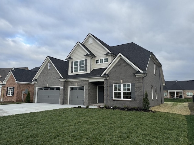 craftsman-style house featuring an attached garage, concrete driveway, a front yard, and brick siding