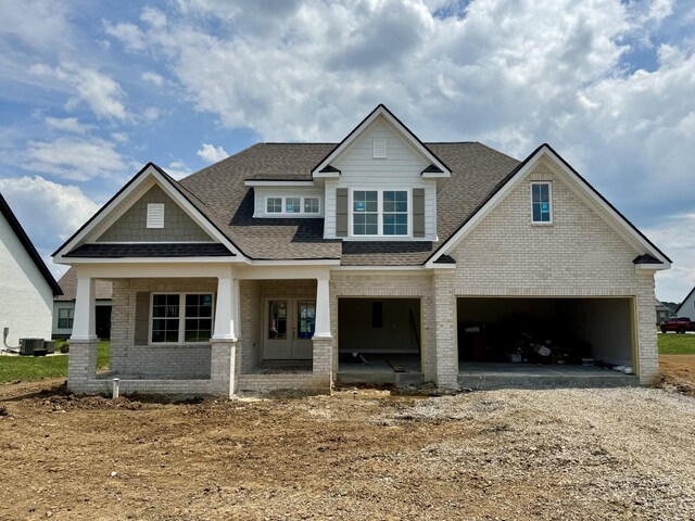 4110 Fargo Ct, Murfreesboro, TN 37127 - craftsman-style house with a shingled roof, brick siding, a garage, and driveway