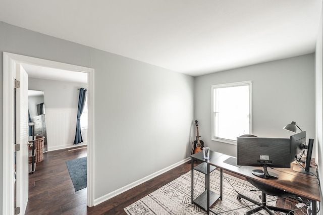 office featuring baseboards and wood finished floors