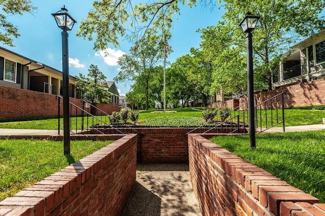 view of community featuring a yard