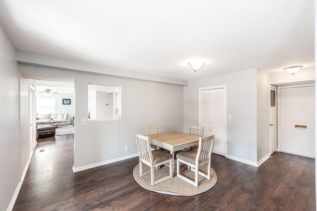 dining room with baseboards, dark wood-style floors, and ceiling fan