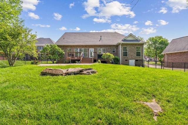 back of property with crawl space, a wooden deck, brick siding, fence, and a yard