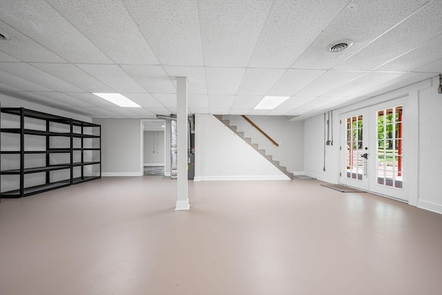606 Fortner Rd, Mc Ewen, TN 37101 - basement with baseboards, stairs, and a paneled ceiling
