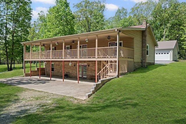 606 Fortner Rd, Mc Ewen, TN 37101 - back of property with a wooden deck, a patio, french doors, a ceiling fan, and a yard