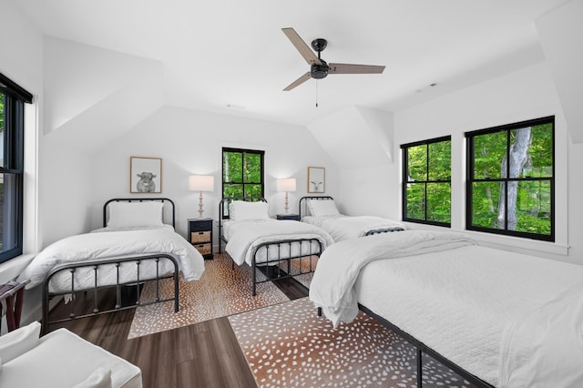 bedroom featuring multiple windows, ceiling fan, and dark wood-type flooring