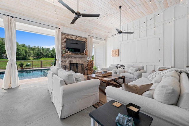 living area featuring high vaulted ceiling, a ceiling fan, wood ceiling, and concrete flooring