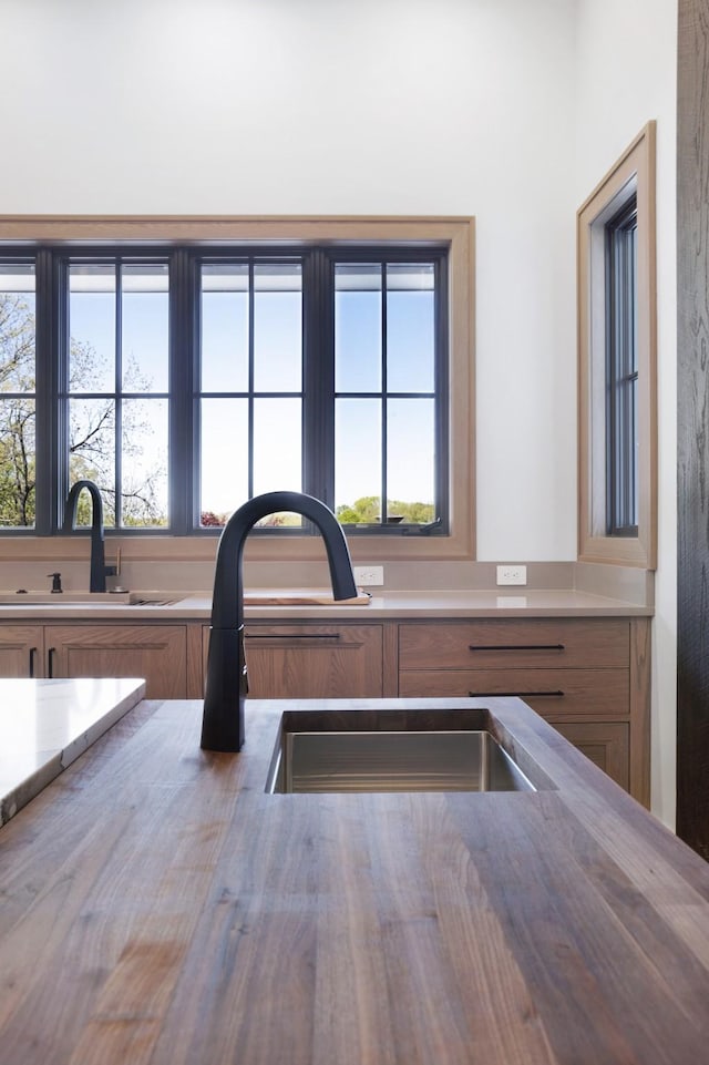 interior details featuring brown cabinets and a sink