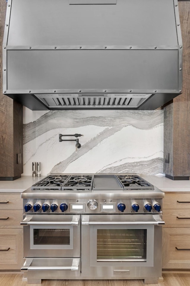 kitchen with light countertops and range with two ovens