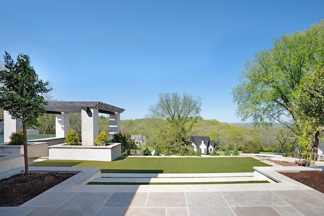 surrounding community with a yard and a pergola