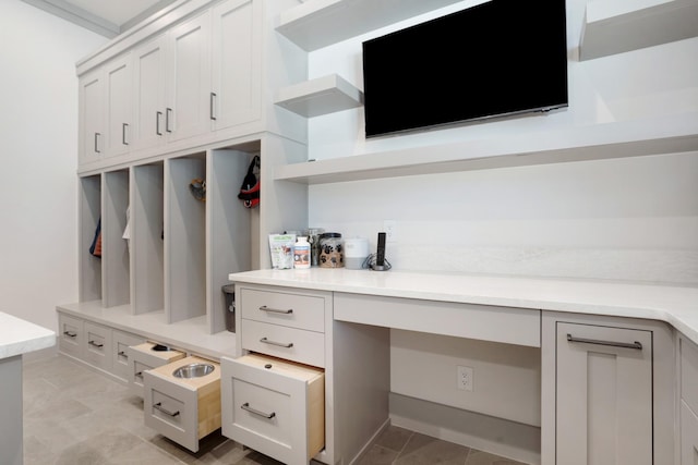 mudroom featuring built in study area
