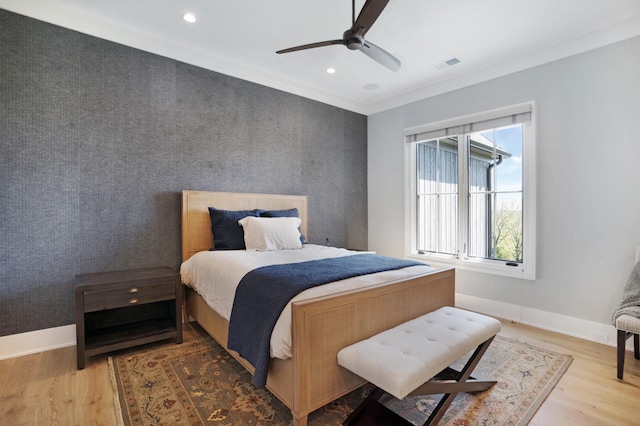 bedroom featuring recessed lighting, crown molding, light wood-type flooring, and visible vents