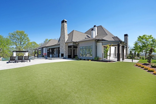 back of property with fence, a pergola, a patio, a chimney, and a lawn