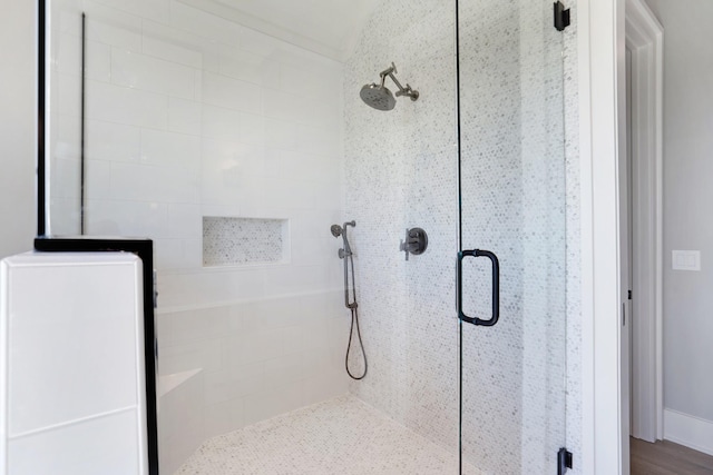 full bath featuring a shower stall
