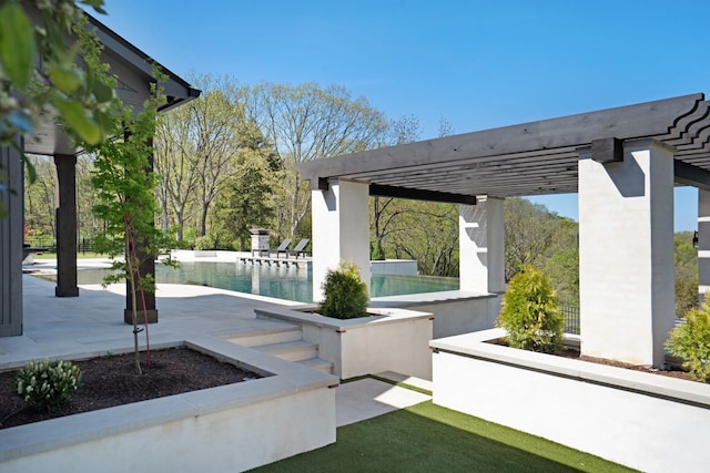 view of patio featuring a pergola and an outdoor pool
