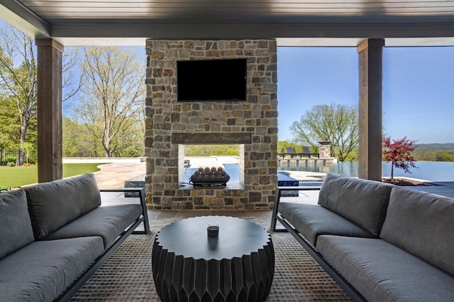 view of patio / terrace featuring an outdoor living space with a fireplace
