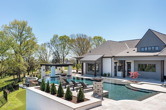 view of pool featuring a patio, a fenced in pool, and a jacuzzi