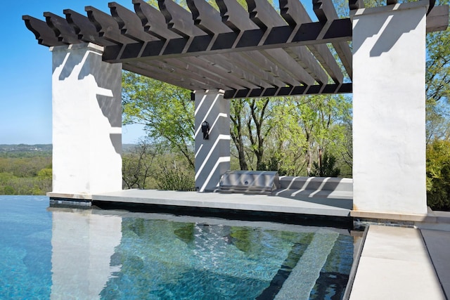 view of pool featuring a grill