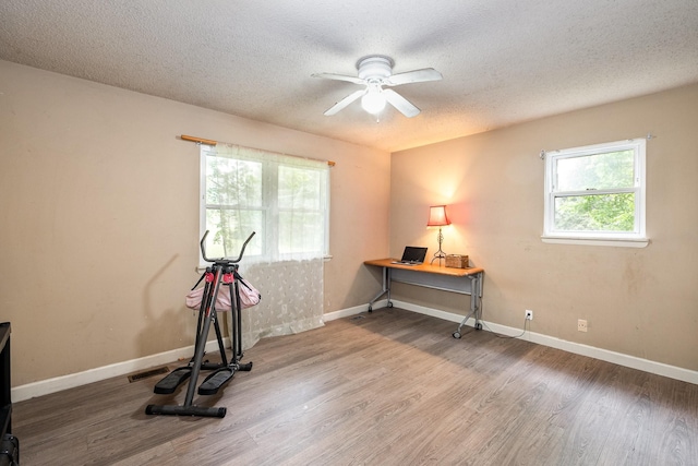 4051 New Highway 96 W, Franklin, TN 37064 - workout room featuring wood finished floors, a textured ceiling, a ceiling fan, and baseboards