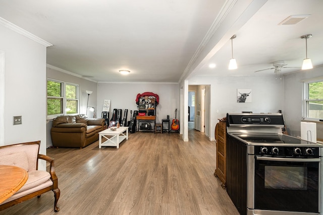4051 New Highway 96 W, Franklin, TN 37064 - kitchen with stainless steel range with electric cooktop, ornamental molding, wood finished floors, open floor plan, and hanging light fixtures
