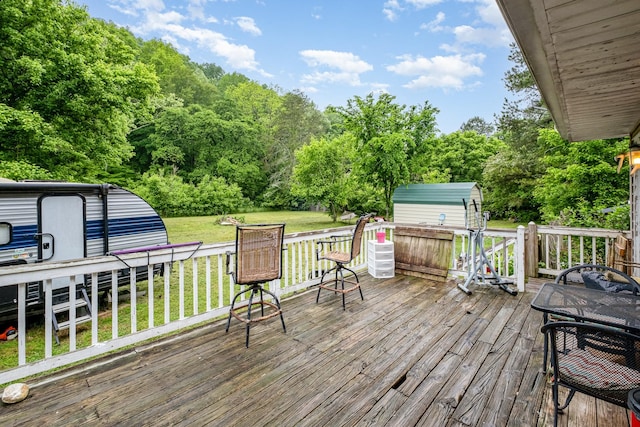 4051 New Highway 96 W, Franklin, TN 37064 - wooden deck with a storage unit, an outbuilding, and a lawn