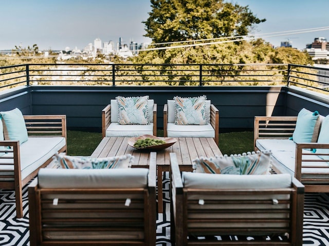 balcony with an outdoor hangout area and a city view