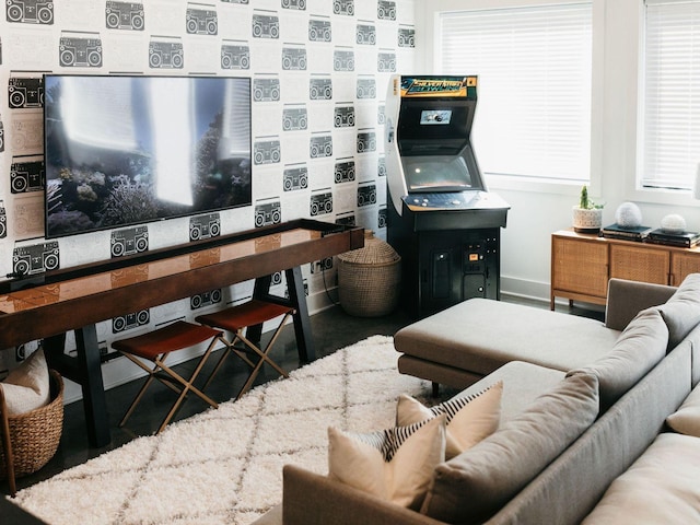 living area featuring baseboards